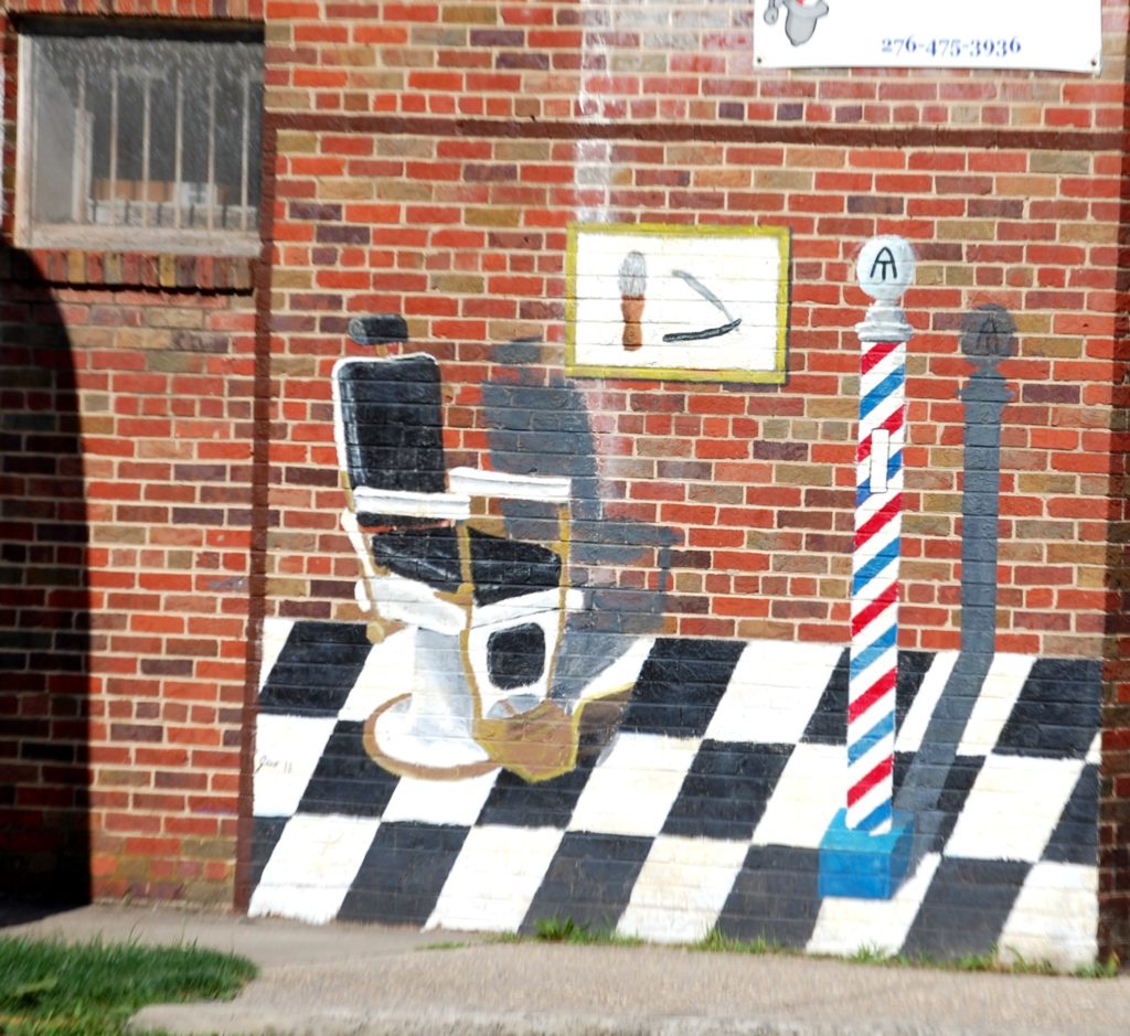 A barber shop mural with the Appalachian Trail logo