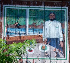 Mural in Damascus advertising the Old Mill Inn