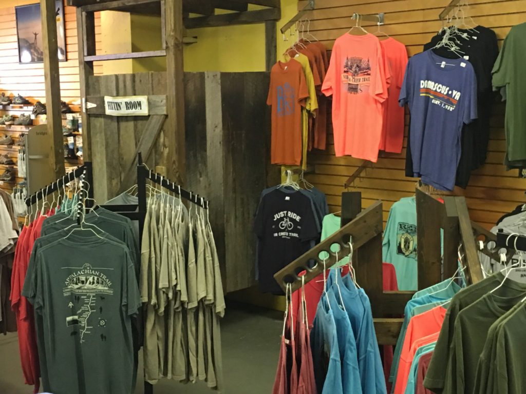 A variety of t-shirts and other amenities at SunDog Outfitters