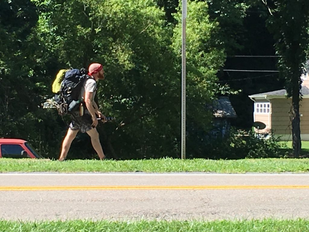 A hiker on the Appalachian Trail walks the trail into Damascus